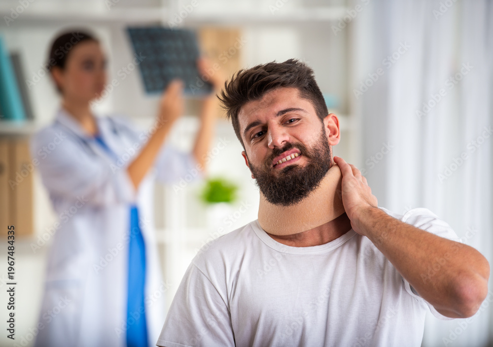 Fototapeta premium Man with neck brace after injury.