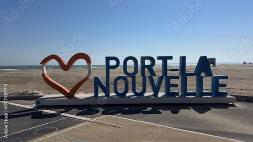 Port La Nouvelle beach sign with red heart ocean sand sunny day