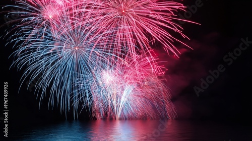 Fireworks Display Over Water During Night Celebration