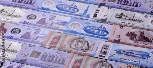 фотографія United Arab Emirates cash, dirhams and coins for exchange and financial transactions