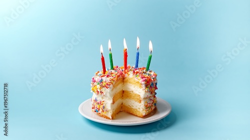 Birthday Cake on Plate With Colorful Candles and Sprinkles Ready for Celebration