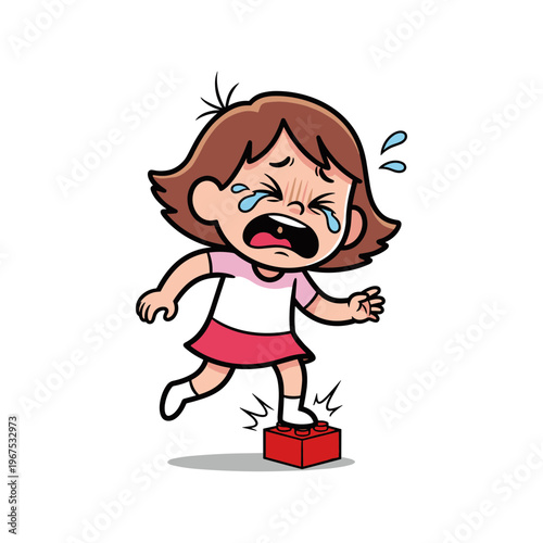 Young girl crying after stepping on a toy brick while standing  