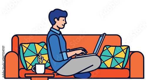 Man sitting on a couch working on laptop with a cup of coffee beside him