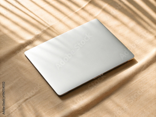Silver Laptop Flat Lay on Warm Beige Gold Satin Fabric Background Elegant Workspace