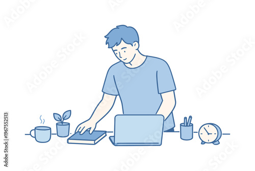 Man organizing workspace desk during calm morning routine, standing at desk arranging notebook and laptop with focused relaxed