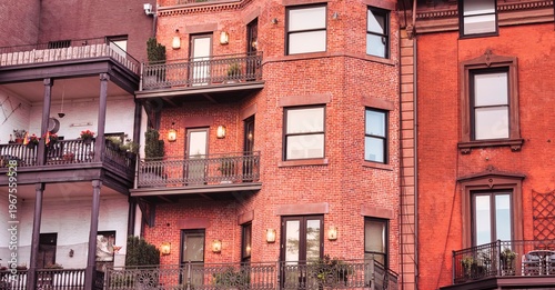 Elegant red brick residential facades with balconies in New York City