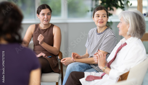 Friendly ladies of different ages having a meaningful conversation while sitting in a circle