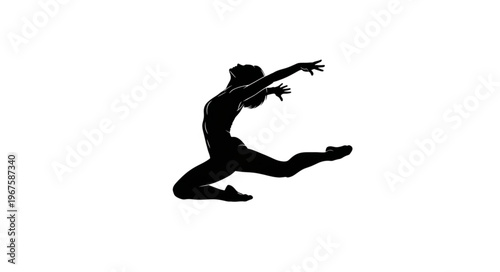 Silhouette of a female ballet dancer in mid-air during a leap.