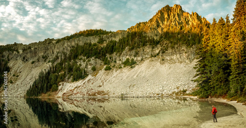 Mount Rainier and mountain lake with forest reflection. Mount Rainier National Park, Washington State, USA.