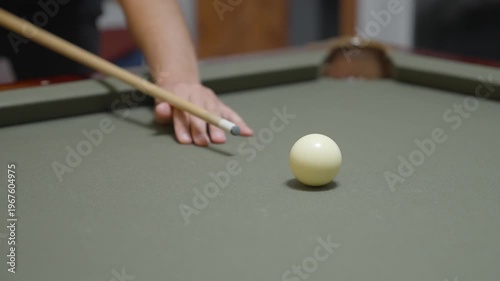 Close-up of a Man Playing Billiards and Pocketing a Ball