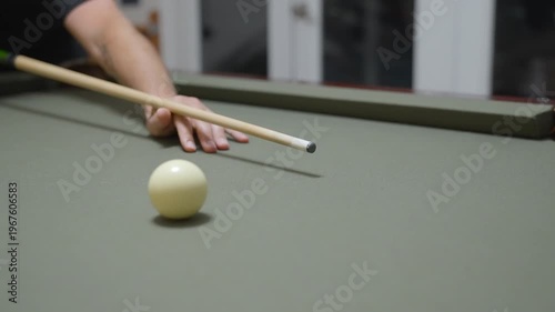 Close-up of a Man Playing Billiards and Pocketing a Ball
