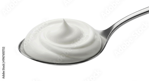 Creamy yogurt or sour cream swirl on a silver spoon on a transparent background
