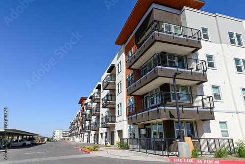 Fotografija Exterior of newly completed multi building apartment complex with balconies and