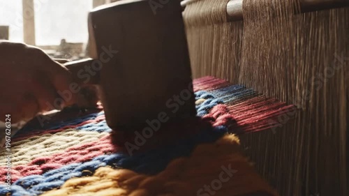 Artisan Hands Weaving a Traditional Carpet with Intricate Designs.
