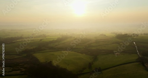 Sunset over green farmland
