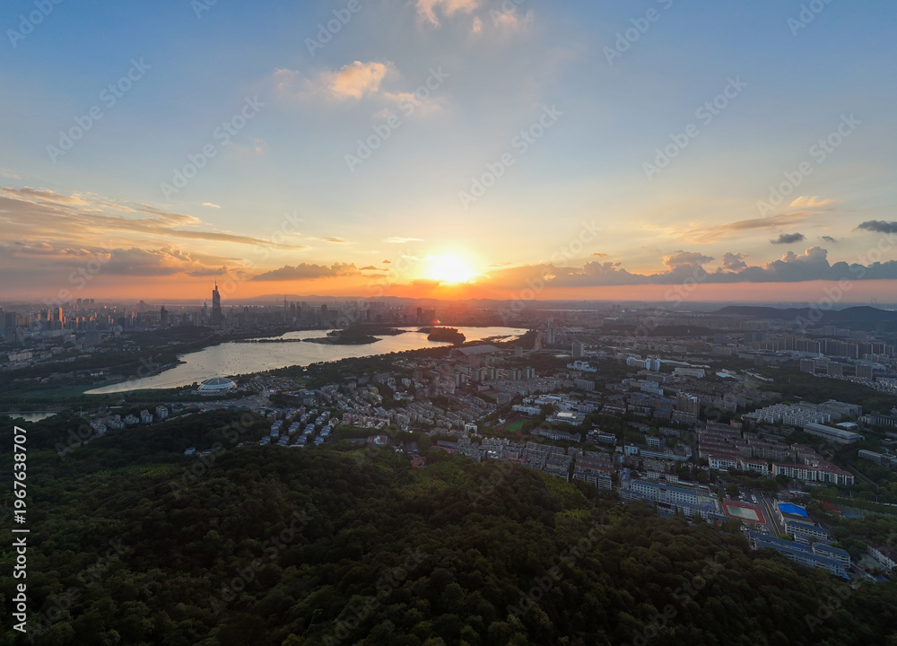 Obraz premium Aerial view of modern city at sunset