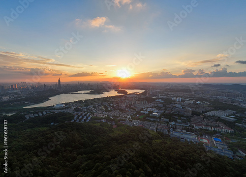 Aerial view of modern city at sunset