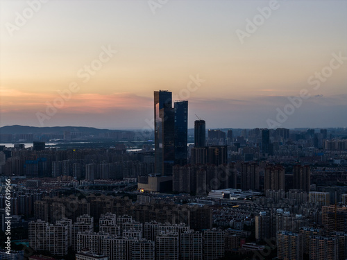 Aerial view of modern city at sunset