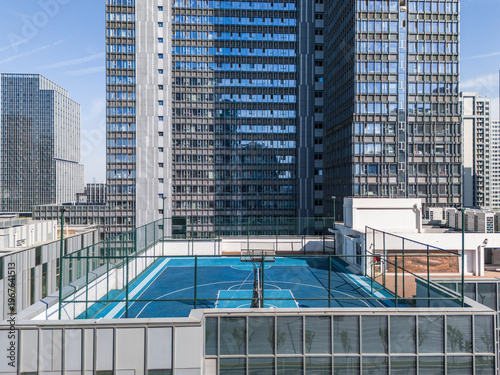 Basketball courts in modern city on rooftop