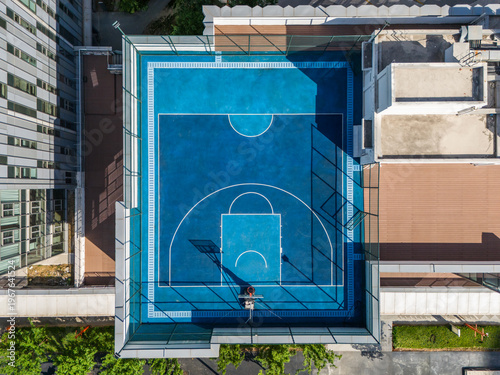 Basketball courts in modern city on rooftop