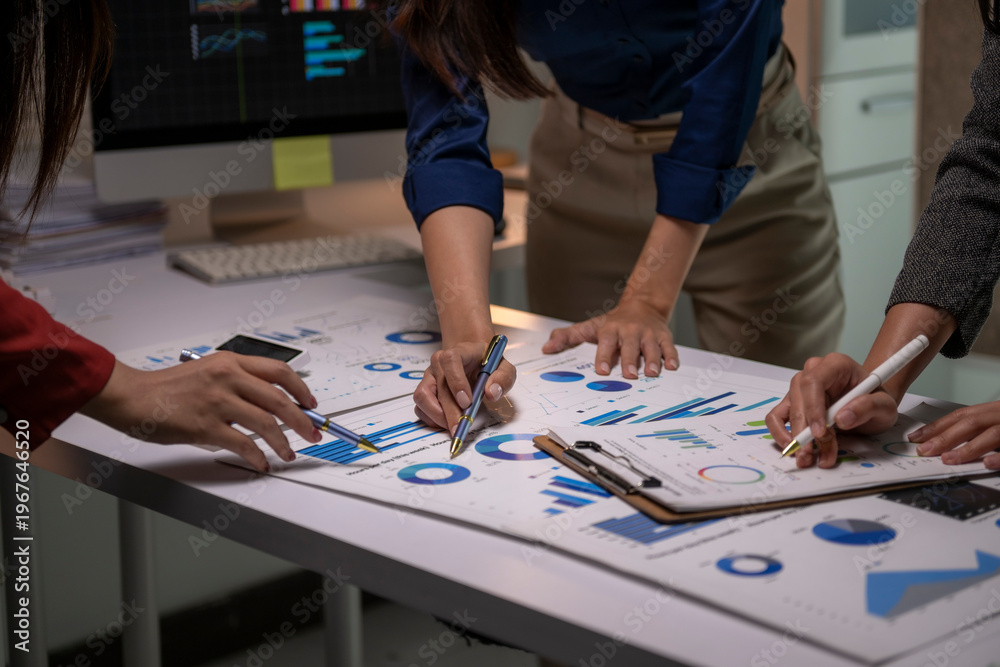 Fototapeta premium Business team analyzing financial data on charts and reports