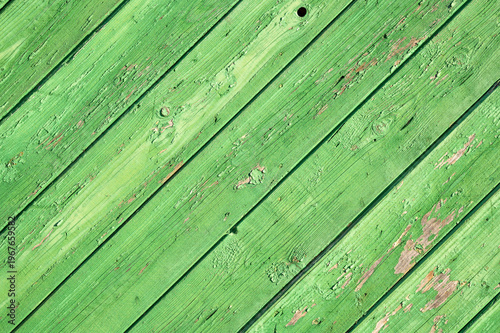 Tableau sur toile Old green painted wooden planks texture background with peeling paint and diagon