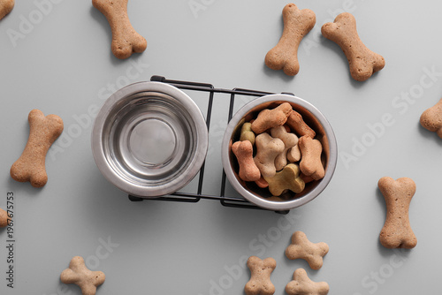 Bowls with tasty dog cookie...