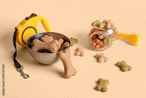 Tasty dog cookies on beige ...