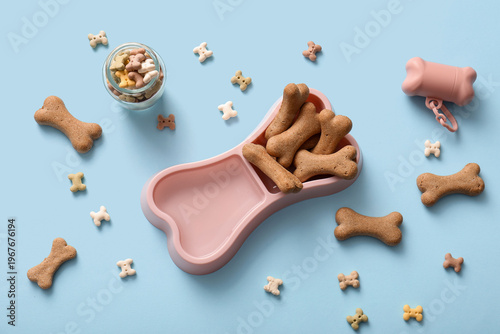 Tasty dog cookies on light ...