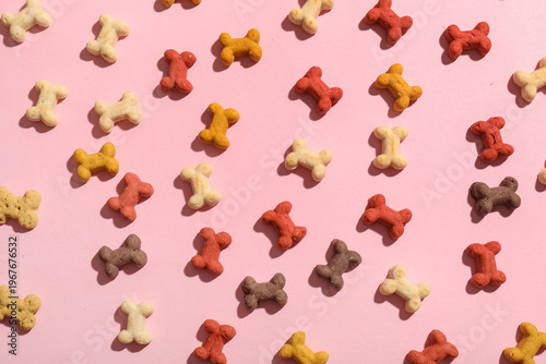 Tasty dog cookies on pink b...