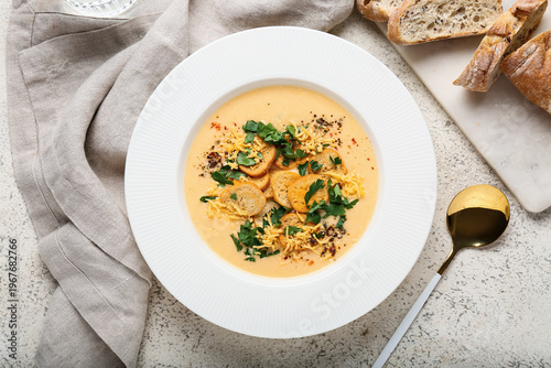 Bowl of tasty cheese soup w...