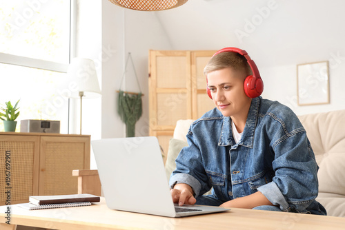 Young woman in headphones w...