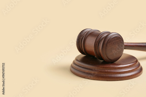 Judge's gavel on beige back...