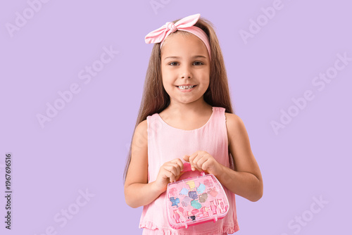 Cute little girl with cosme...