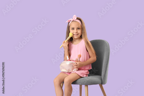 Cute little girl with cosme...