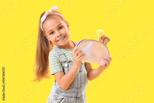Cute little girl with cosme...