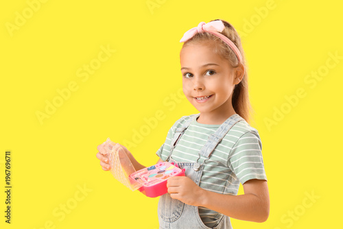 Cute little girl with cosme...