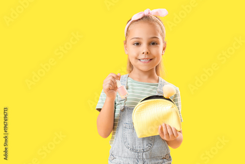 Cute little girl with cosme...