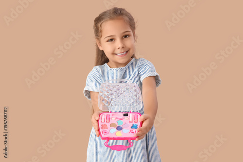Cute little girl with cosme...