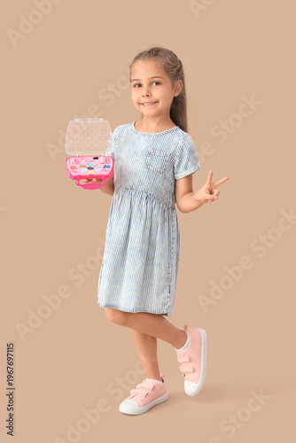 Cute little girl with cosme...