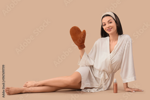 Young woman in bathrobe wit...