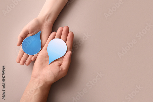 Female hands with paper wat...