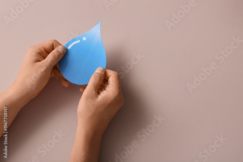 Female hands with paper wat...