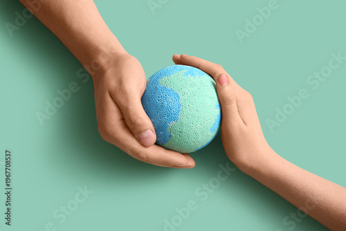 Female hands with model of ...