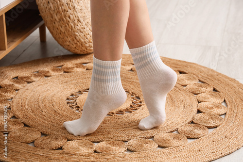 Legs of woman in white sock...