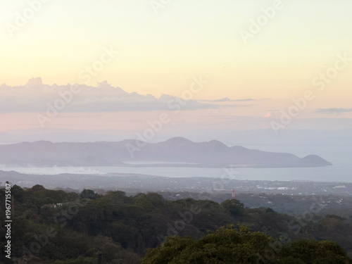 View from a mountain overlooking a bay at sunset in Nicaragua
