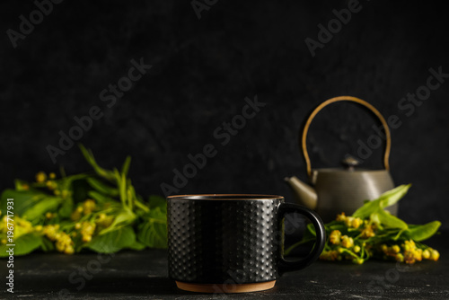 Cup and teapot of hot linde...