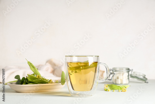 Glass cup of hot linden tea...
