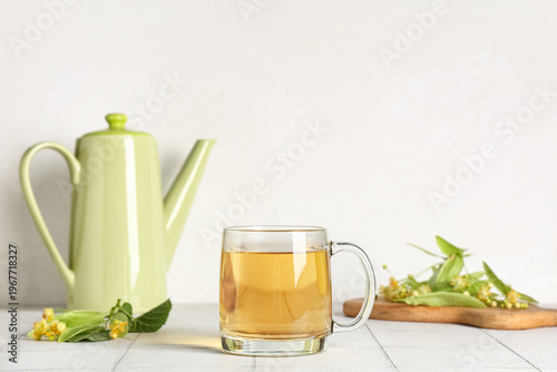 Glass cup and teapot of hot...