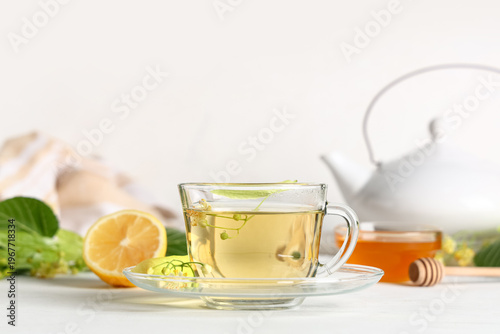 Glass cup of hot linden tea...